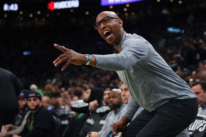 Philadelphia 76ers assistant coach Sam Cassell reacts to a play